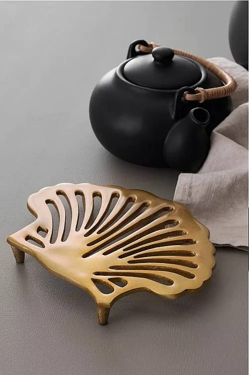 Golden Shell gryteunderlag